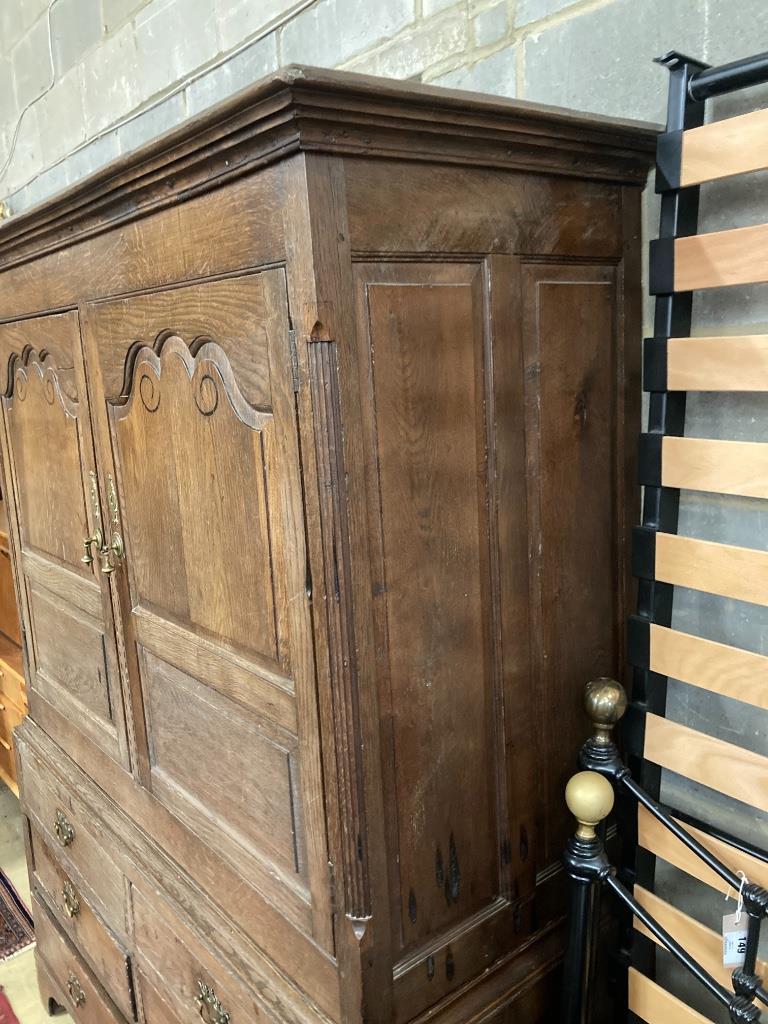 A George III inlaid oak press cupboard, width 140cm, depth 60cm, height 184cm